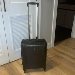 Tegra lite, hard body, TUMI black roller carry-on! 🧳